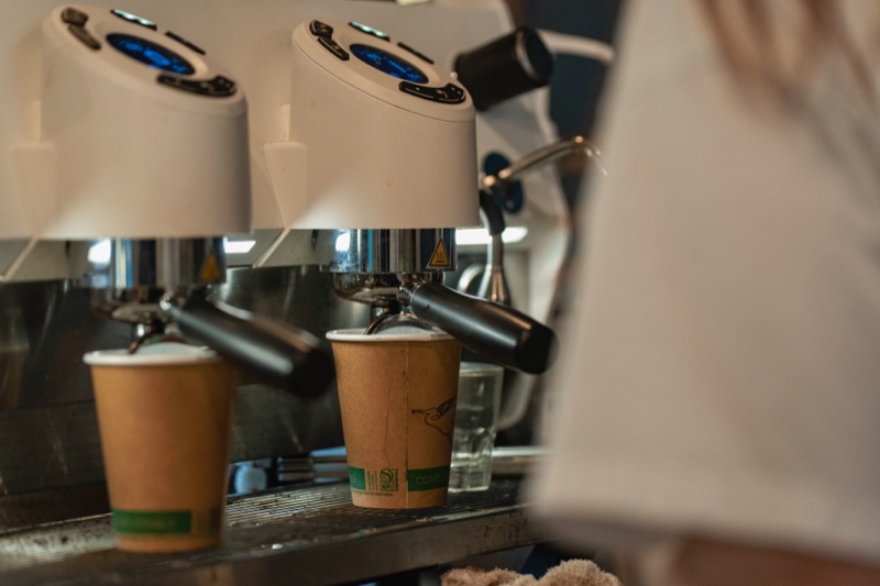 Two compostable cups ready at the Crane Coffee bar