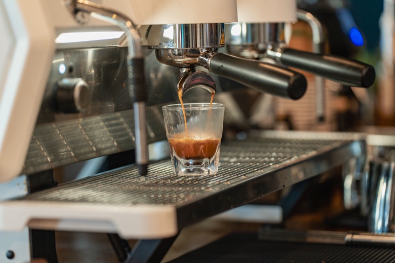 Espresso pouring into a glass at Crane Coffee