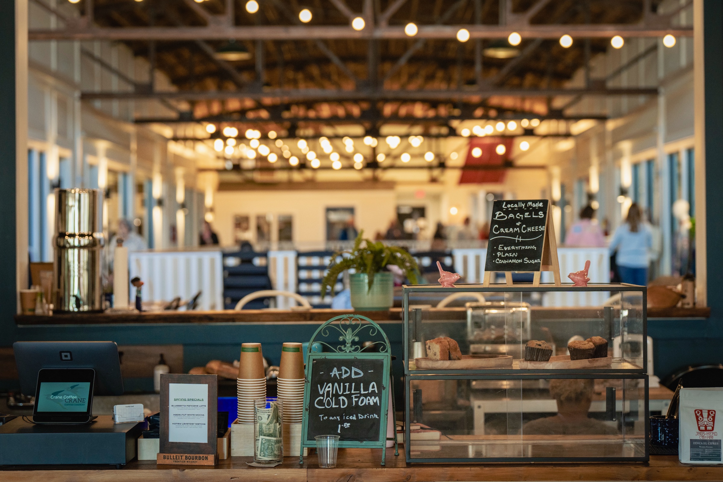 Inside Crane Coffee Co. — the specialty coffee bar at The District Exchange in downtown Concord, North Carolina
